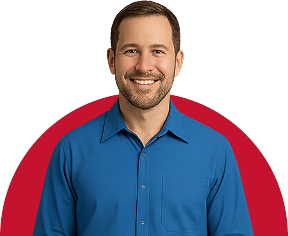 A smiling man with short brown hair and a beard wears a bright blue button-up shirt. He stands in front of a white background with a red semicircle behind him, representing trusted Long Distance Movers Chicago IL.